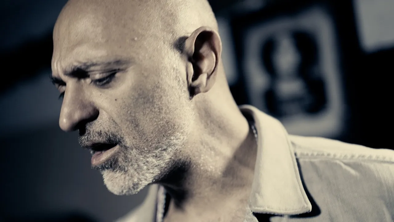 Still from the Watching From the Wings music video