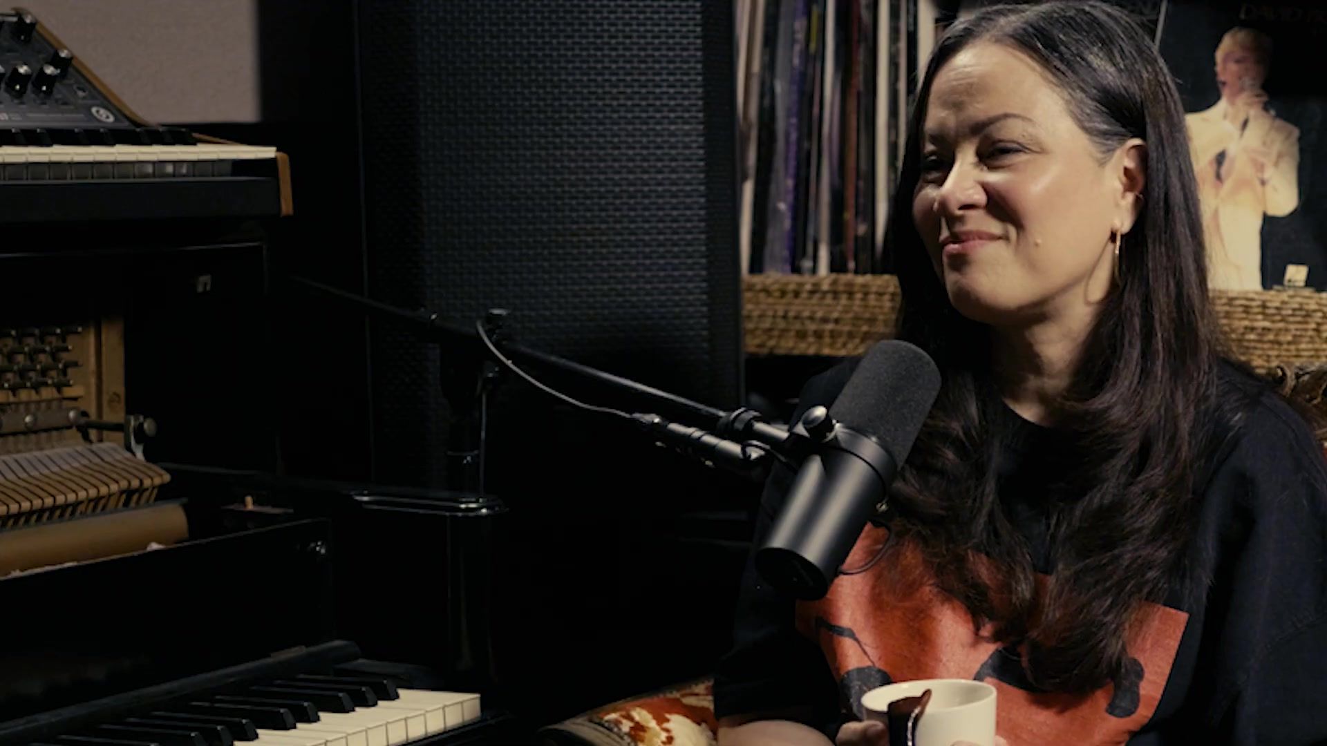 Shannon Lee in conversation in Reza Safinia's studio, beside a piano
